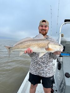 Angler holding a 29-inch Atlantic Croaker in TX