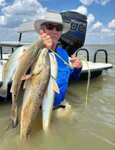 One angler landing a large fish in Matagorda