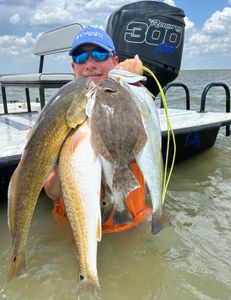 Man fishing with two big fish in Matagorda