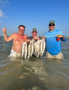 Three people fishing in TX