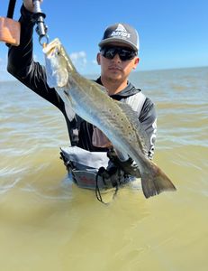 A lone fisherman in TX catching a 23-inch fish