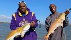 Two redfish, 15 inches long, caught while fishing in Matagorda