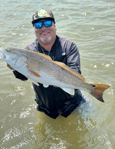 A person fishing in TX with a 30-inch fish