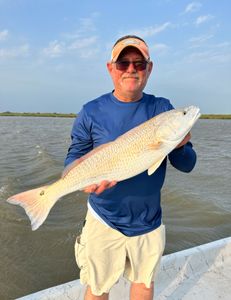 A lone angler reels in a 23-inch catch in TX
