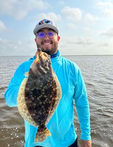 Angler with a 23-inch Summer Flounder in Matagorda