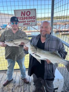 Two striped bass caught by three people in OK