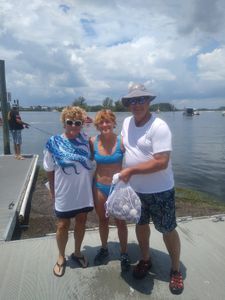 Three people enjoying a fishing trip in Brooksville