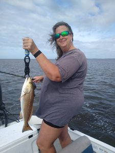 Angler catches a 15-inch redfish in FL