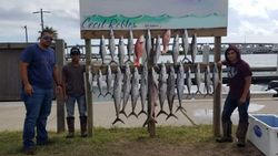 Four people enjoying a fishing trip in TX