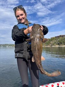 Angler catching a blue catfish in MO
