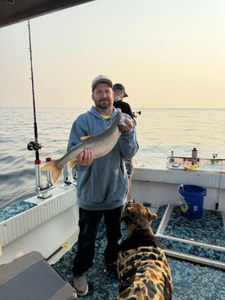An angler's successful catch in Altmar