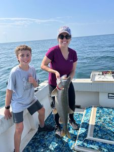 Two anglers enjoy a fishing trip in Altmar