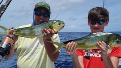 Two anglers on the water at Emerald Isle, fishing with rods