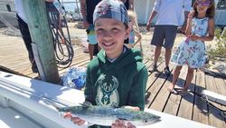 One fisherman reeling in a catch at Emerald Isle