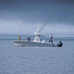 Three people fishing at the Hingham location