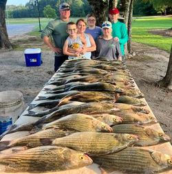 A group of 5 people fishing in GA