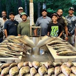 Group of 8 people enjoying fishing excursion in Appling