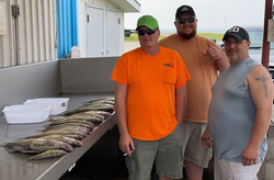 Three people fishing in Michigan