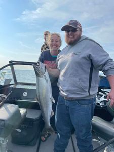 Coho salmon being caught while fishing in MI
