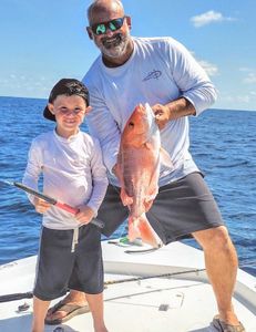 Anglers catching a fish in FL