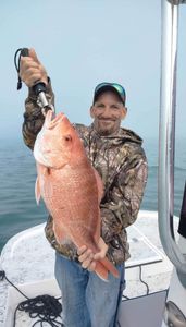 A lone fisherman with a big fish catch in Port Isabel