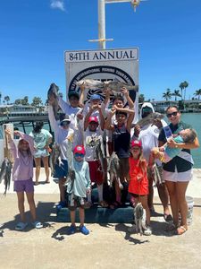 group of 11 people fishing in port isabel