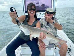 Two people fishing in Port Isabel