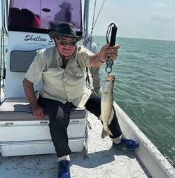 A single person fishing in Port Isabel
