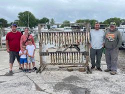 6 people fishing in Port Clinton