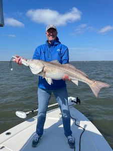 Angler in Holmes Beach with a fishing rod
