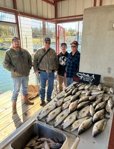 Four people fishing at OK location