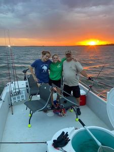 Three people fishing in Madill