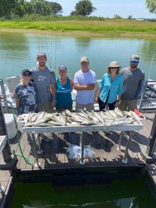 Group of 6 people fishing in Madill