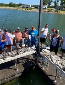 Seven people enjoying a fishing trip in OK