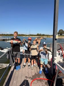 5 people fishing in Madill