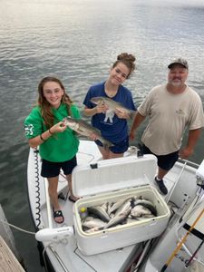 2 striped bass fish caught by 3 people in OK