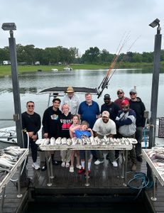 Group of 12 people fishing in Madill