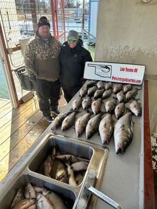 Two striped bass caught by two people in OK