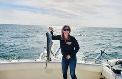 Skillful fisherman catches a fish in NY