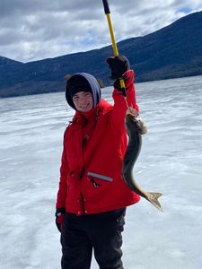 Lone fisherman in NY happily reeling in a 21-inch catch