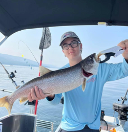 Angler catching large fish at Lake George