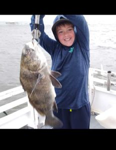 Angler with a big Black Drum fish in FL