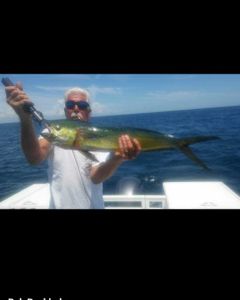 Angler holding a 33-inch fish in Jensen Beach