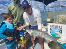 3 people fishing for a snook in Florida