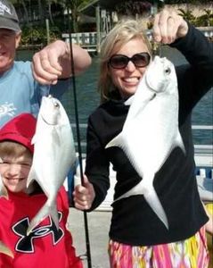 Two large great pompano and florida pompano fish caught on a fishing tour in Florida