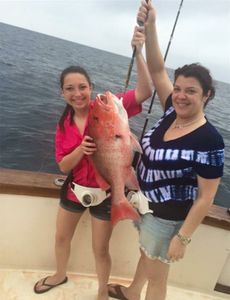 Two anglers with a big 22-inch fish in FL