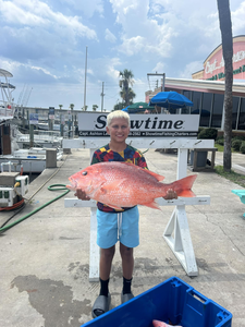 One fisherman holding a big 29-inch fish in FL.