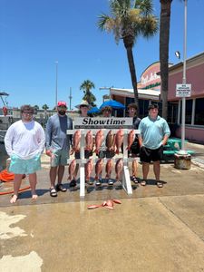 Group of 7 people enjoying fishing trip in Panama City Beach