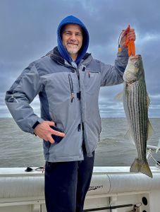 Reeling in Striper makes a gloomy day beautiful