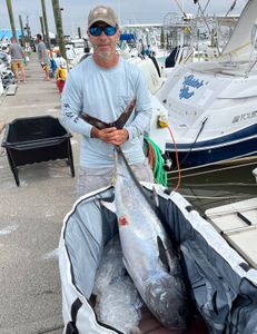Two anglers with a large 305-inch fish on Port Monmouth Road